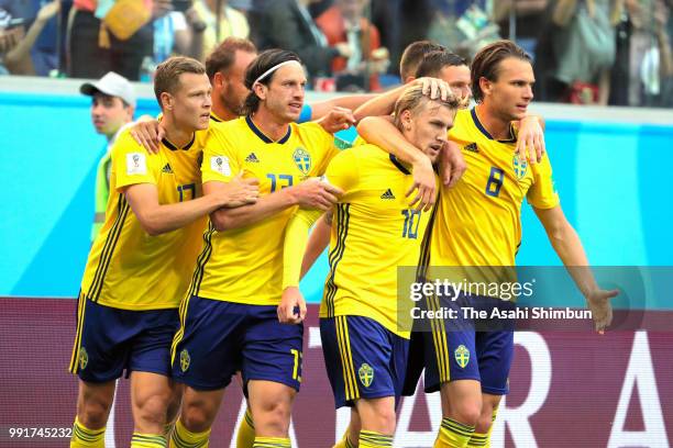 Emil Forsberg of Sweden celebrates scoring the opening goal with his team mates during the 2018 FIFA World Cup Russia Round of 16 match between...