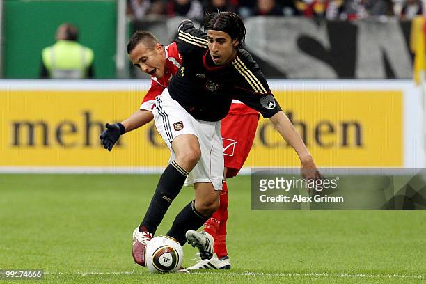 Sami Khedira of Germany is challenged by Andrew Cohen of Malta during the international friendly match between Germany and Malta at Tivoli stadium on...