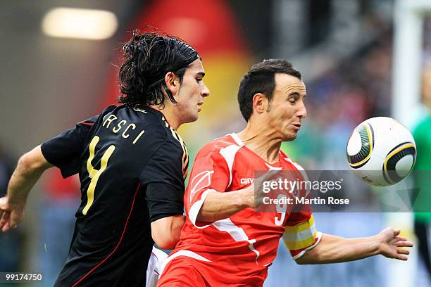 Serdar Tasci of Germany and Roderick Briffa of Malta compete for the ball during the international friendly match between Germany and Malta at Tivoli...