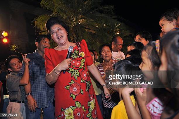 Philippine's former first lady Imelda Marcos sings during a victory party at the Marcos mansion in Batac, northern province of Ilocos Norte, on May...