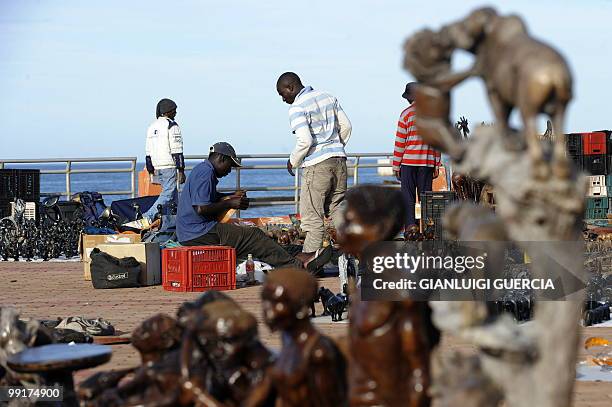 South African street vendors display and sell african merchandise and articraft on King's beach promenade on May 13, 2010 in Port Elizabeth, South...