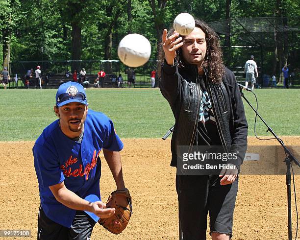 Actors Corbin Bleu and Constantine Maroulis throw the opening pitch for the 56th Season of the Broadway Softball League opening day at Central Park,...