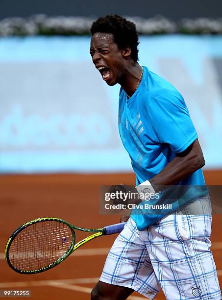 Gael Monfils of France celebrates after winning the first set against Guillermo Garcia-Lopez of Spain in their third round match during the Mutua...