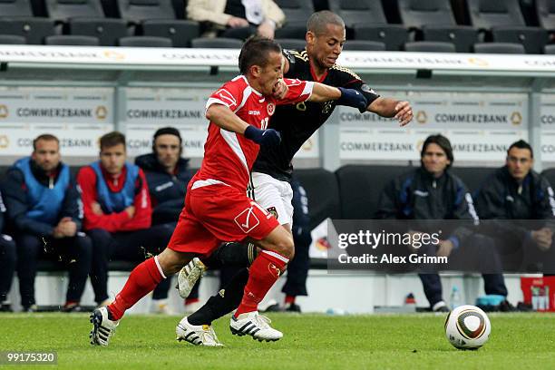 Dennis Aogo of Germany is challenged by Andrew Cohen of Malta during the international friendly match between Germany and Malta at Tivoli stadium on...