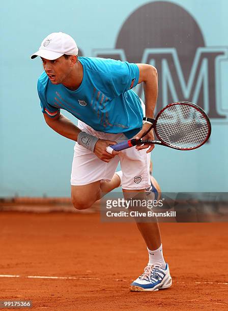 Mike Bryan of the USA in action against Benjamin Becker of Germany and Marco Chiudinelli of Switzerland in their second round doubles match during...