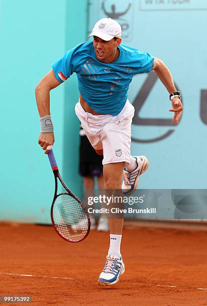 Mike Bryan of the USA in action against Benjamin Becker of Germany and Marco Chiudinelli of Switzerland in their second round doubles match during...