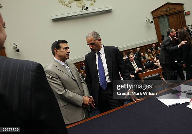 Attorney General Eric Holder talks with Darrell E. Issa , before the start of a House Judiciary Committee hearing on Capitol Hill May 13, 2010 in...