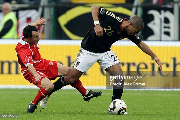 Dennis Aogo of Germany is challenged by Michael Mifsud of Malta during the international friendly match between Germany and Malta at Tivoli stadium...