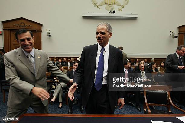 Attorney General Eric Holder is greeted by Rep. Darrell E. Issa , before the start of a House Judiciary Committee hearing on Capitol Hill on May 13,...