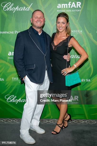 Kevin Robert Frost and a guest attend the amfAR Paris Dinner 2018 at The Peninsula Hotel on July 4, 2018 in Paris, France.