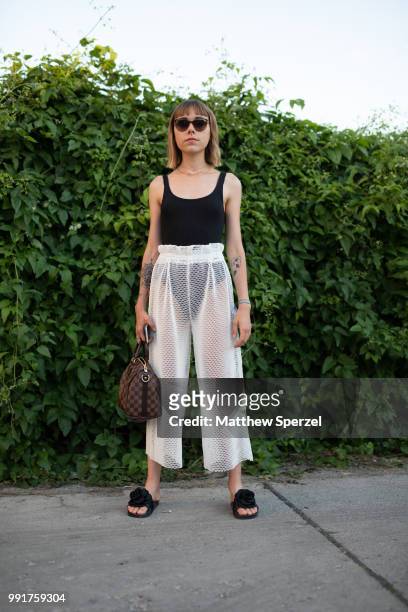 Ema Etoile is seen attending Danny Reinke wearing black bodysuit with white scheer skirt during the Berlin Fashion Week July 2018 on July 4, 2018 in...