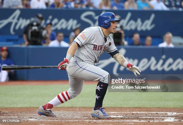 Asdrubal Cabrera of the New York Mets hits an RBI single in the fifth inning during MLB game action against the Toronto Blue Jays at Rogers Centre on...