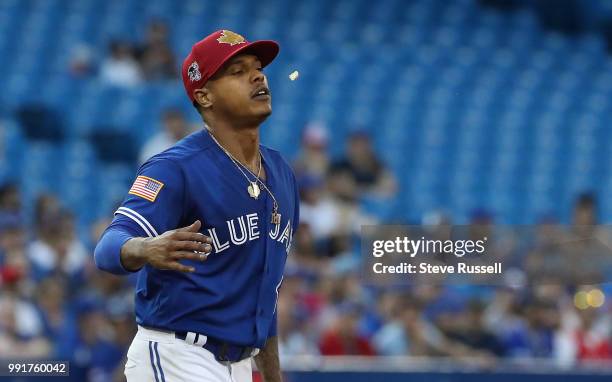 Toronto Blue Jays starting pitcher Marcus Stroman spits out his gum in frustration after giving up a run on a Asdrubal Cabrera hit in the fifth...