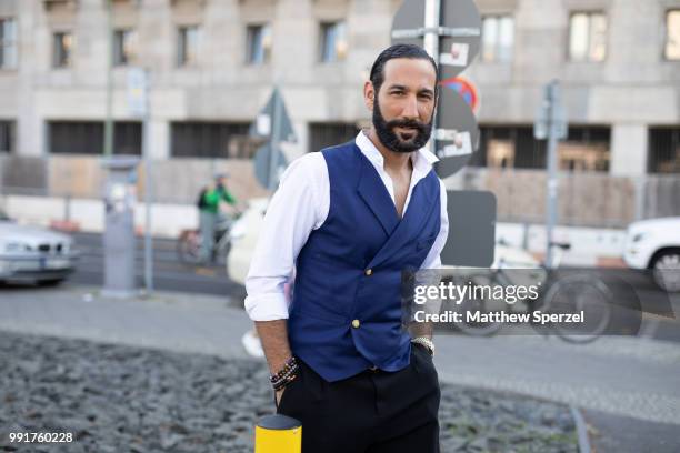 Massimo Sinato is seen attending Riani wearing cobalt vest with white shirt during the Berlin Fashion Week July 2018 on July 4, 2018 in Berlin,...