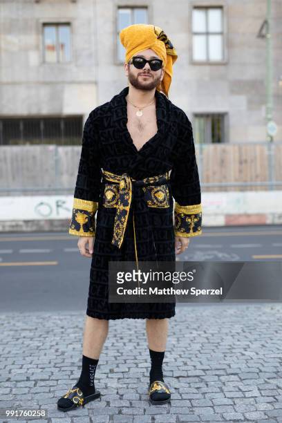 Riccardo Simonetti is seen attending RIANI wearing Versace during the Berlin Fashion Week July 2018 on July 4, 2018 in Berlin, Germany.