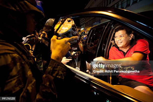 Thai soldiers check for weapons at a checkpoint in downtown Bangkok on May 13, 2010 in Bangkok, Thailand. Protesters and military forces clashed in...