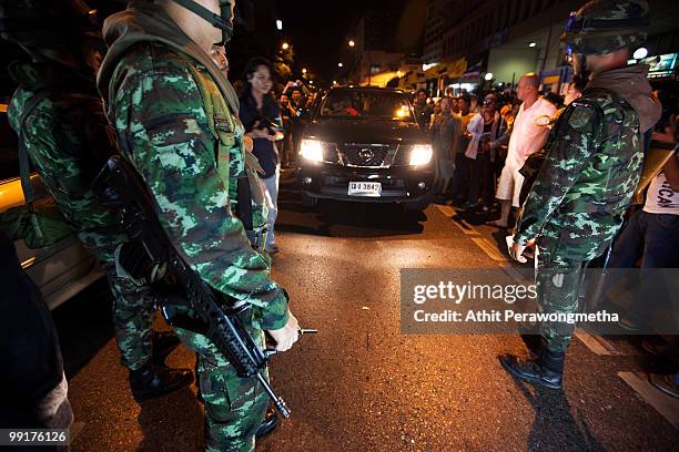 Thai soldiers check for weapons at a checkpoint in downtown Bangkok on May 13, 2010 in Bangkok, Thailand. Protesters and military forces clashed in...