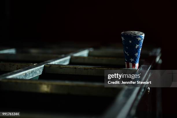 Bat wrapped in American flag tape sits in the bat rack prior to the MLB game between the St. Louis Cardinals and Arizona Diamondbacks at Chase Field...