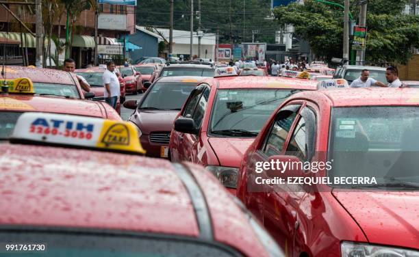 Taxi drivers protest against Uber for the second consecutive day outside the presidential house in San Jose, on July 4, 2018.