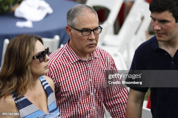 Scott Pruitt, administrator of the Environmental Protection Agency , center, and his wife Marlyn Pruitt, left, attend a picnic for military families...