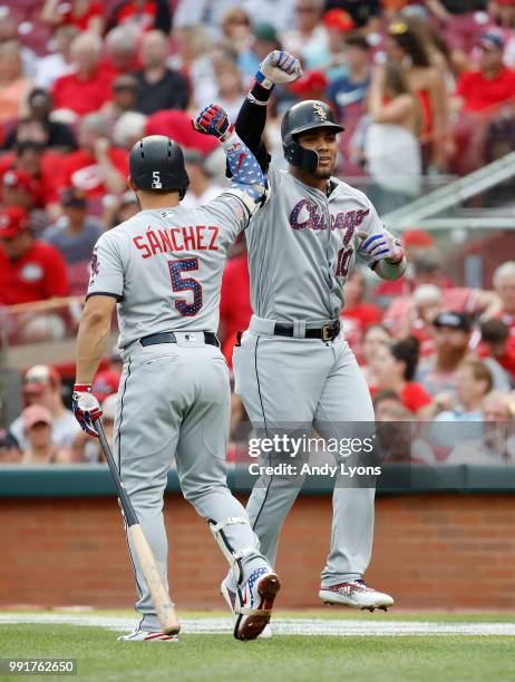 Yoan Moncada of the Chicago White Sox rcelebrates with Yolmer Sanchez after hitting a home run in the third inning against the Cincinnati Reds at...