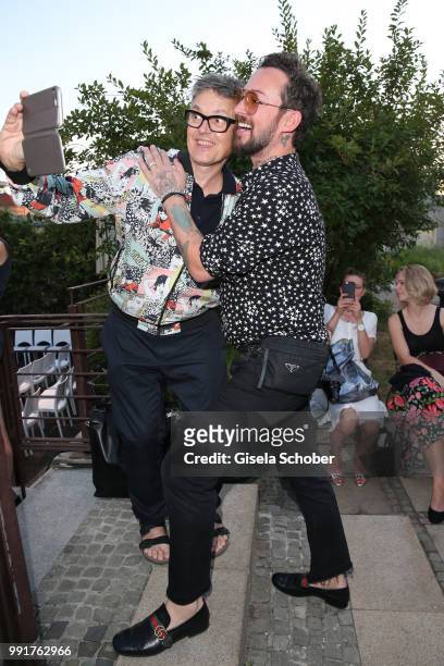 Rolf Scheider takes a selfie with Fashion designer Marcel Ostertag during the Marcel Ostertag show during the Berlin Fashion Week Spring/Summer 2019...