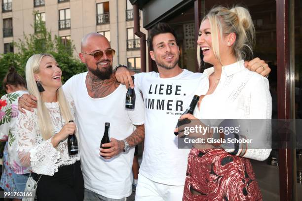 Niklas Schroeder and his girlfriend Jessica Neufeld , Leonard Freier, Chethrin Schulze attends the Marcel Ostertag show during the Berlin Fashion...