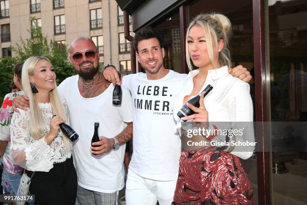 Niklas Schroeder and his girlfriend Jessica Neufeld , Leonard Freier, Chethrin Schulze attends the Marcel Ostertag show during the Berlin Fashion...