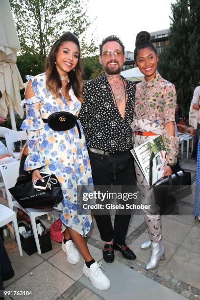 Julia Steyns, Fashion designer Marcel Ostertag, Anh Phoenix attend the Marcel Ostertag show during the Berlin Fashion Week Spring/Summer 2019 at...