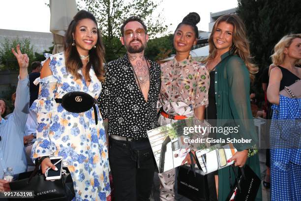 Julia Steyns, Fashion designer Marcel Ostertag, Anh Phoenix and Farina Opoku attend the Marcel Ostertag show during the Berlin Fashion Week...