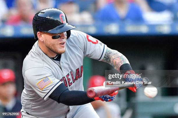 The Cleveland Indians' Roberto Perez lays down a sacrifice bunt to move the runners to second and third in the second inning against the Kansas City...