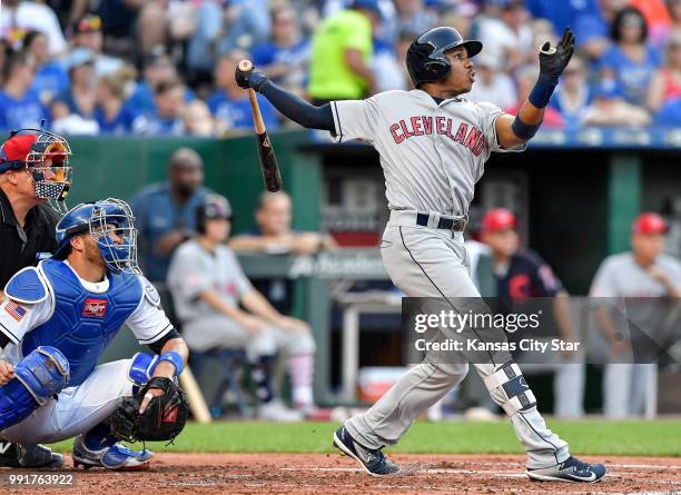 The Cleveland Indians' Greg Allen follows through on a sacrifice fly to score Jason Kipnis in the second inning against the Kansas City Royals on...