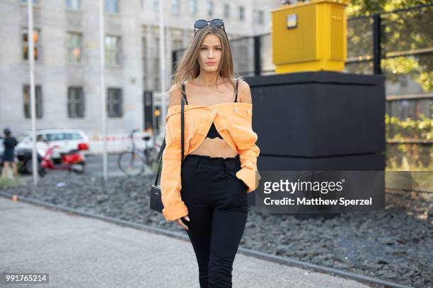 Neele Bronst is seen attending RIANI wearing a styled orange jacket with black pants during the Berlin Fashion Week July 2018 on July 4, 2018 in...