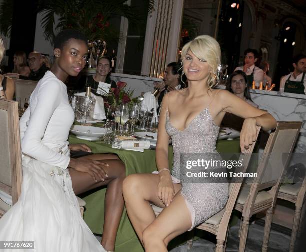 Maria Borges and Alisa Volskaya attend the amfAR Paris Dinner at The Peninsula Hotel on July 4, 2018 in Paris, France.