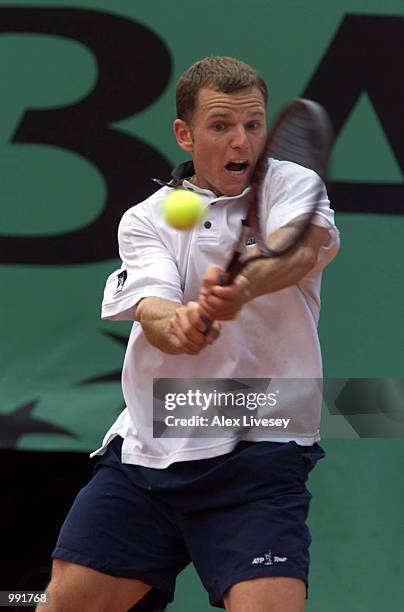 Michael Russell of the USA returns in his fourth round match against Gustavo Kuerten of Brazil during the French Open Tennis at Roland Garros, Paris,...