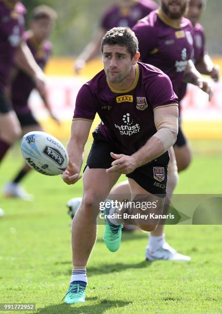 Andrew McCullough passes the ball during a Queensland Maroons State of Origin training session at Sanctuary Cove on July 5, 2018 in Gold Coast,...