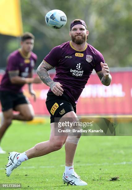 Josh McGuire keeps his eye on the ball during a Queensland Maroons State of Origin training session at Sanctuary Cove on July 5, 2018 in Gold Coast,...