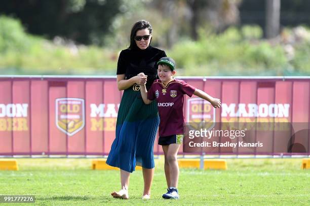 Billy Slater's son Jake Slater is seen to by his mother Nicole Slater after injuring himself playing with other kids during a Queensland Maroons...