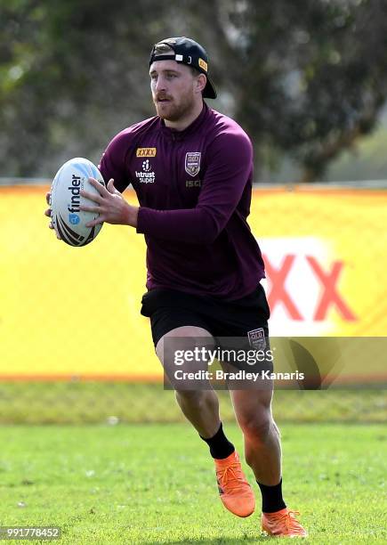 Cameron Munster runs with the ball during a Queensland Maroons State of Origin training session at Sanctuary Cove on July 5, 2018 in Gold Coast,...