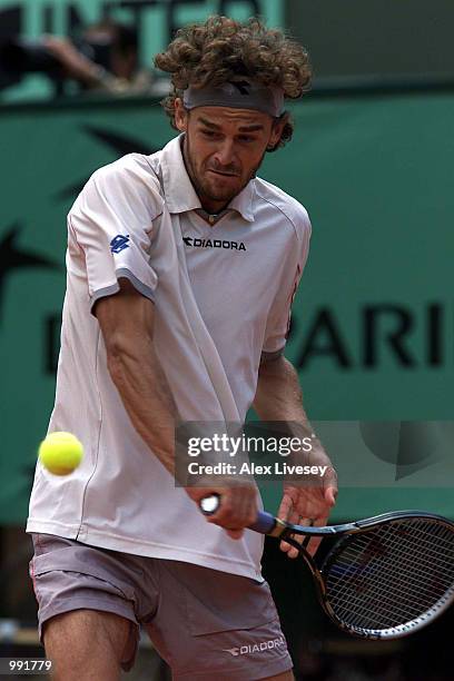 Gustavo Kuerten of Brazil returns in his fourth round match against Michael Russell of the USA during the French Open Tennis at Roland Garros, Paris,...