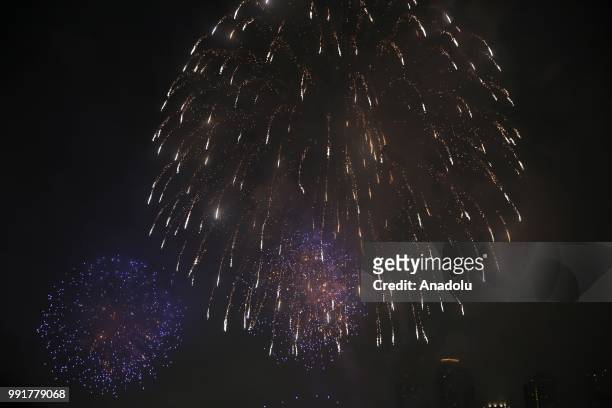 People watch Fourth of July fireworks from Gantry Plaza State Park in Queens, United States on July 4, 2018.