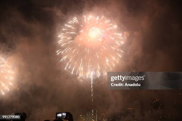 People watch Fourth of July fireworks from Gantry Plaza State Park in Queens, United States on July 4, 2018.