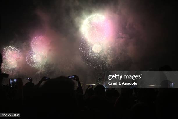 People watch Fourth of July fireworks from Gantry Plaza State Park in Queens, United States on July 4, 2018.