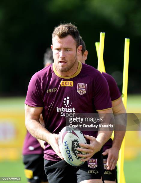 Gavin Cooper runs through a training drill during a Queensland Maroons State of Origin training session at Sanctuary Cove on July 5, 2018 in Gold...