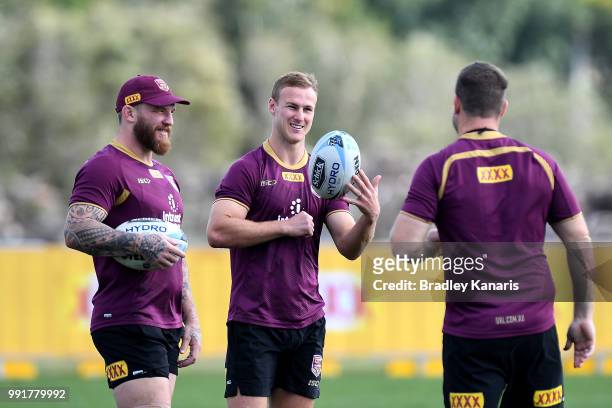 Daly Cherry-Evans chats with team mates during a Queensland Maroons State of Origin training session at Sanctuary Cove on July 5, 2018 in Gold Coast,...