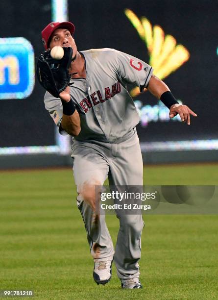 Michael Brantley of the Cleveland Indians catches a fly ball off the bat of Rosell Herrera of the Kansas City Royals in the eighth inning at Kauffman...