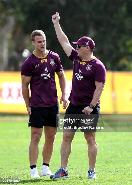Coach Kevin Walters chats with Daly Cherry-Evans during a Queensland Maroons State of Origin training session at Sanctuary Cove on July 5, 2018 in...