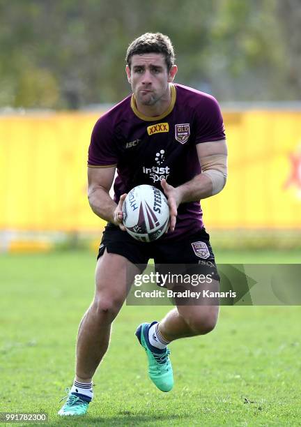 Andrew McCullough passes the ball during a Queensland Maroons State of Origin training session at Sanctuary Cove on July 5, 2018 in Gold Coast,...