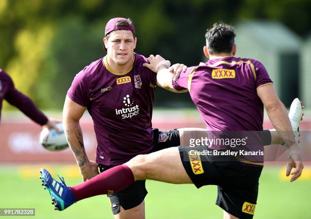 Jarrod Wallace and Billy Slater warm-up during a Queensland Maroons State of Origin training session at Sanctuary Cove on July 5, 2018 in Gold Coast,...