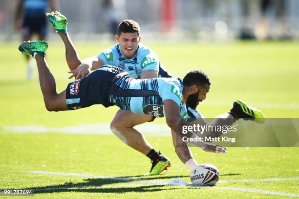 Josh Addo-Carr dives in front of Nathan Cleary during a New South Wales Blues State of Origin training session at NSWRL Centre of Excellence Field on...